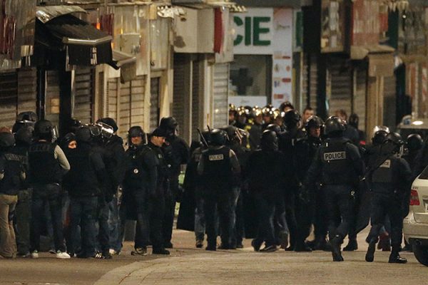 French special police forces secure the area during an operation to catch Paris attack fugitives in Saint-Denis