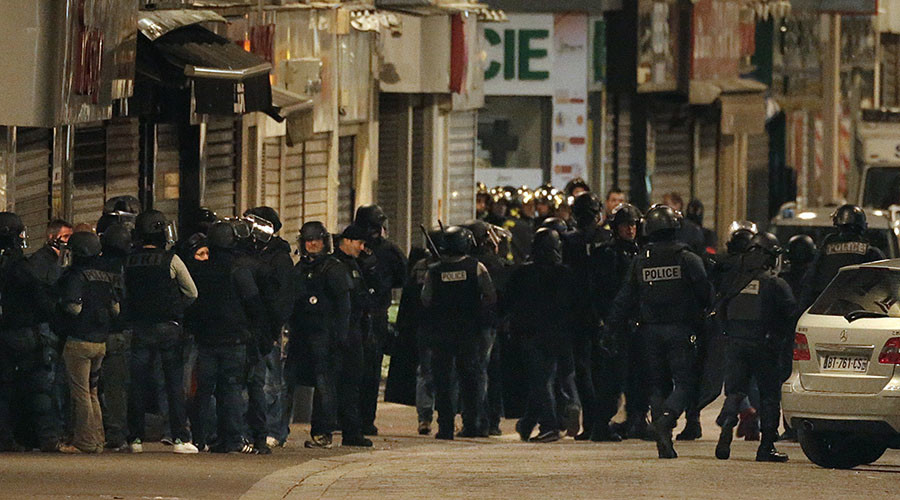 French special police forces secure the area during an operation to catch Paris attack fugitives in Saint-Denis